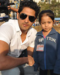 Vijender singh on his knees at the school of Annual day