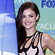 Actress Lucy Hale poses with her award in the press room backstage at the Teen Choice Awards in Los Angeles