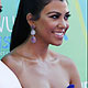 Kim Kardashian and Kourtney Kardashian arrive at the Teen Choice Awards in Los Angeles