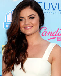 Actress Lucy Hale poses as she arrives at the Teen Choice Awards at the Gibson amphitheatre in Universal City, California