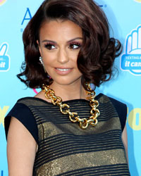 British singer Cher Lloyd poses as she arrives at the Teen Choice Awards at the Gibson amphitheatre in Universal City, California