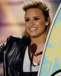 Singer Demi Lovato accepts the Choice TV Personality: Female Award at the Teen Choice Awards at the Gibson amphitheatre in Universal City, California