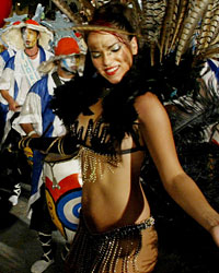 Members of a 'Comparsa' musical group play the candombe, an Afro-Uruguayan rhythm that is played with drums during the llamadas parade in Montevideo