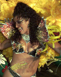 An afro-Uruguayan woman dances candombe during the presentation of his 'Comparsa' (candombe group) at the annual 'llamadas' parade, a typical festival dating back to the Spanish domination of Latin America