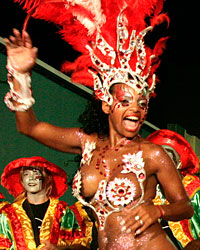 Members of a 'comparsa', a carnival band, participate in the 'llamadas' parade in Montevideo