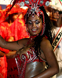 Members of a 'Comparsa' musical group play the candombe, an Afro-Uruguayan rhythm that is played with drums during the llamadas parade in Montevideo