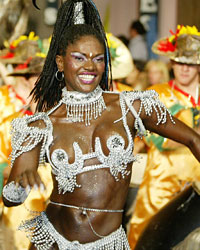 A woman dances the candombe during the 'Llamadas' parade in Montevideo