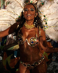 Members of a comparsa, an Uruguayan carnival band, perform during the second night of the Llamadas parade in Montevideo