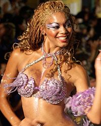 Members of a 'comparsa', a carnival band, participate in the 'llamadas' parade in Montevideo