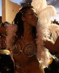 Members of a comparsa, an Uruguayan carnival band, plays the drums to perform candombe music and dance during the first night of the Llamadas parade in Montevideo