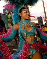 Members of a 'comparsa', a carnival band, participate in the 'llamadas' parade in Montevideo