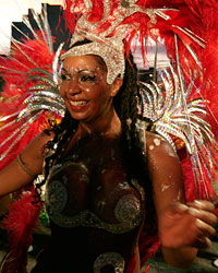 Members of a 'comparsa', a carnival band, participate in the 'llamadas' parade in Montevideo