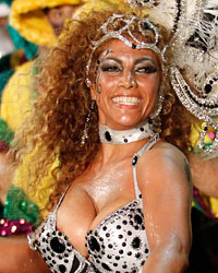 Members of a comparsa, an Uruguayan carnival band, perform during the second night of the Llamadas parade in Montevideo