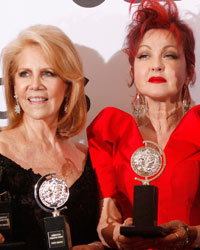 Producers Hal Luftig (L) and Daryl Roth join Cyndi Lauper and Billy Porter as they pose with their awards for 'Kinky Boots' at the American Theatre Wing's annual Tony Awards in New York