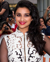 Parineeti Chopra poses as she arrives for a screening of her film 'A Random Desi Romance' at the 38th Toronto International Film Festival