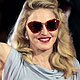 U.S. pop star and director Madonna, poses for photographers as she arrives on the 'W.E' red carpet at the 68th Venice Film Festival