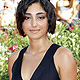 Actress Golshifteh Farahani poses for photographers on the 'Poulet Aux Prunes' red carpet at the 68th Venice Film Festival