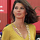 Actress Marisa Tomei poses for photographers as she arrives on the 'The Ides of March' red carpet at the 68th Venice Film Festival in Venice