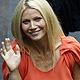 Gwyneth Paltrow waves as she arrives for a news conference of her film 'Contagion' at the 68th Venice Film Festival