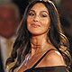 Monica Bellucci poses for photographers as she arrives on the 'Un Ete Brulant' red carpet at the 68th Venice Film Festival