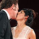 Actor John C. Reilly kisses his wife Alison Dickey as they pose for photographers on the 'Carnage' red carpet at the 68th Venice Film Festival in Venice