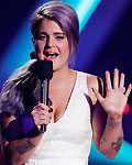 Kelly Osbourne introduces the band 'Metric' during the VH1 Divas 2012 show in Los Angeles