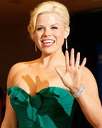 Actress Megan Hilty waves on the red carpet at the annual White House Correspondents' Association dinner in Washington