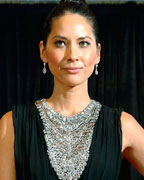 Actress Olivia Munn arrives on the red carpet at the annual White House Correspondents' Association dinner in Washington