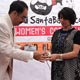 Participant of 3rd SB Women`s Car Rally receiving participation trophy.