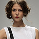 A model presents a creation by Russian designer Tanya Arzhanova during Belarus Spring-Summer 2012 Fashion Week in Minsk