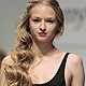 A model presents a creation by Russian designer Tanya Arzhanova during Belarus Spring-Summer 2012 Fashion Week in Minsk