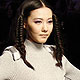A model presents a creation at the 2012 China Knitwear Fashion design contest show during China Fashion Week in Beijing