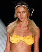 A model presents a creation from the Salinas 2013-2014 summer collection during Rio Fashion Week in Rio de Janeiro