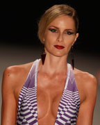 Models present creations from Triya 2013-2014 summer collection during Rio Fashion Week in Rio de Janeiro