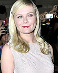 Kirsten Dunst poses at the gala presentation for the film 'On the Road' at the Toronto International Film Festival