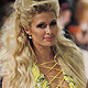 U.S. socialite Paris Hilton presents a creation by Ukrainian designer Andre Tan during Ukrainian Fashion Week in Kiev