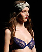 A model presents a creation from TCN collection at the Pasarela 080 Barcelona Fashion Show