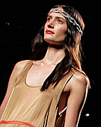 A model presents a creation from TCN collection at the Pasarela 080 Barcelona Fashion Show