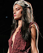 A model presents a creation from TCN collection at the Pasarela 080 Barcelona Fashion Show