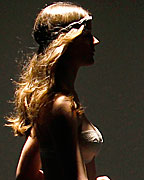 A model presents a creation from TCN collection at the Pasarela 080 Barcelona Fashion Show