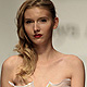 A model presents a creation by Russian designer Tanya Arzhanova during Belarus Spring-Summer 2012 Fashion Week in Minsk