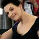 French actress Binoche waves during a photocall for Austrian director Haneke's in-competition film 'Cache' at the 58th Cannes Film Festival.