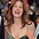 Michelle Monaghan is kissed by Kilmer & Robert Downey Jr. during a photocall for Shane Black's film 'Kiss Kiss Bang Bang' in Cannes.