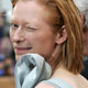 British actress Swinton winks during red carpet arrivals at Cannes Film Festival.