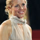 Maria Bello poses on red carpet during arrivals for 'A History of Violence' at 58th Cannes Film Festival.