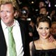 Actor Michael Madsen and Brittany Murphy pose during red carpet arrivals for director Robert Rodriguez and Frank Miller's film 'Sin City' at Cannes Film Festival.