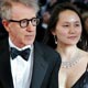 US director Allen arrives with his wife Soon during red carpet arrivals for the out of competition screening of his film Match Point at the 58th Cannes Film Festival.