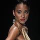 A model displays a creation by Trinidad and Tobago designer Meiling at a fashion show during the Dominicana fashion week in Santo Domingo