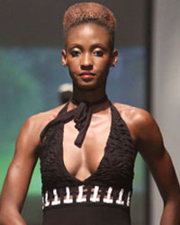 A model presents a creation by designer Sonia Noel of Sonia Noel Designs during the first runway show of the inaugural Guyana Fashion Week at Rahaman's Park in Houston