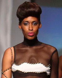 A model presents a creation from Tyrone Nelson during the final runway show of the inaugural Guyana Fashion Week